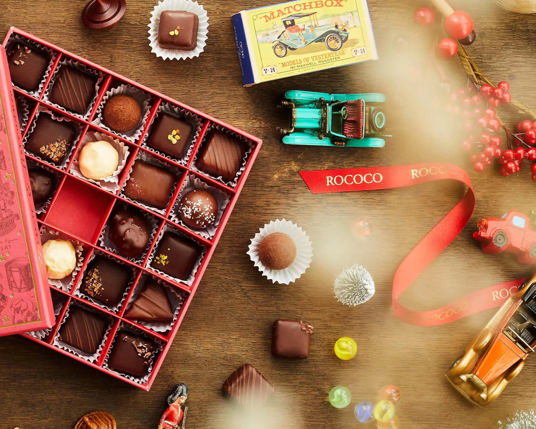 Luxury festive chocolate selection box by Rococo Chocolates, available for delivery to make Christmas gifting effortless.