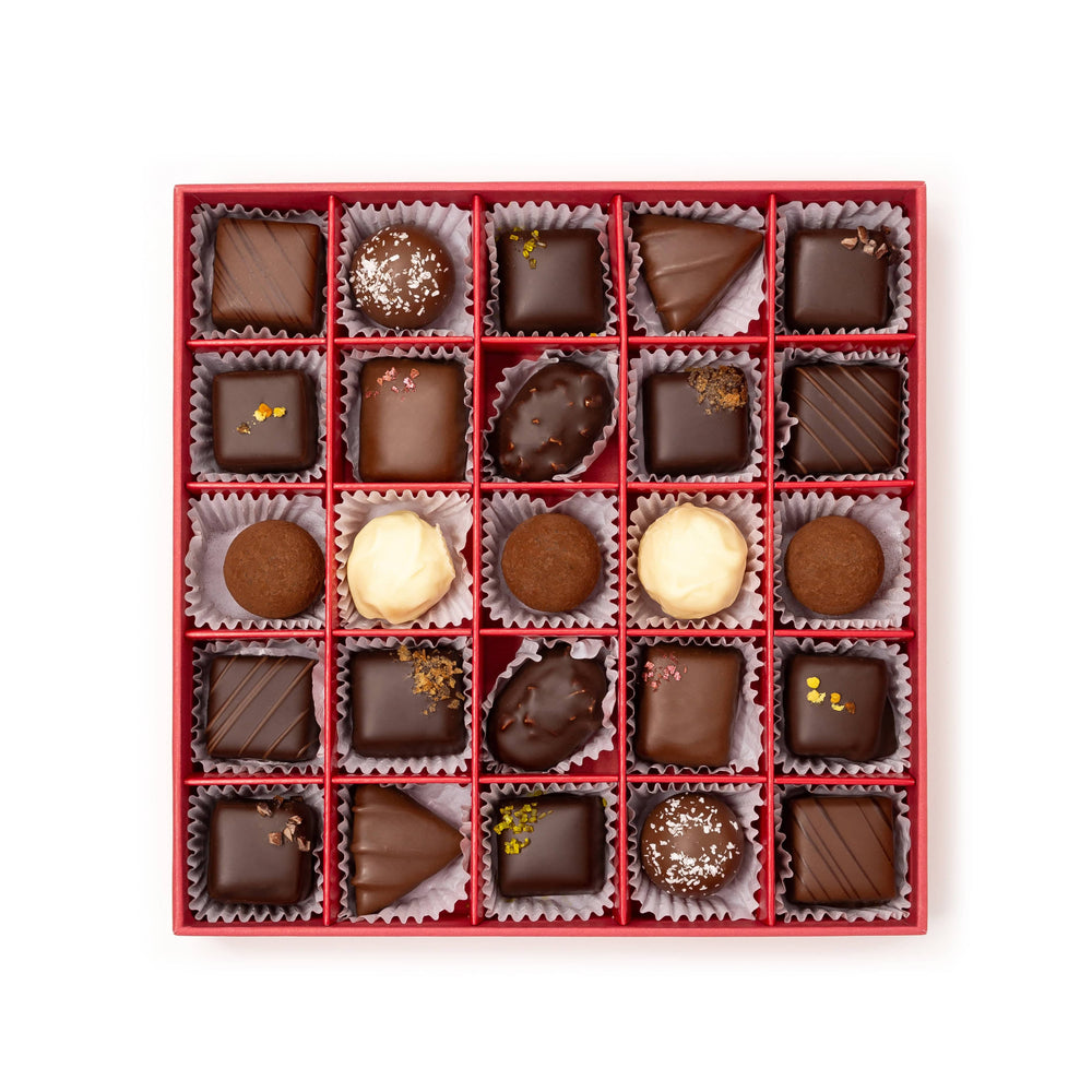 Festive chocolate box with a variety of truffles and ganaches, including pistachio praline and stollen marzipan.